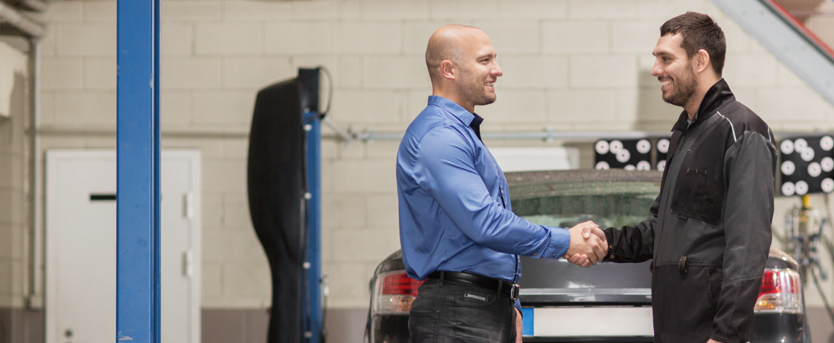 Man and mechanic handshaking | A Plus Automotive